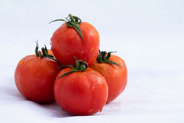 Washed And Cleaned Indian Desi Locally Grown Fresh Red And Orange Colored Tomatoes Plucked Fresh From Farmland Are Decorated On White Background With Blank Copy Space For Custom Text