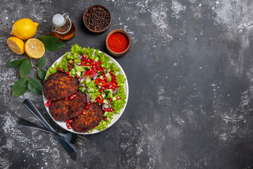 top view meat cutlets with salad and bread on grey background meal dish photo food