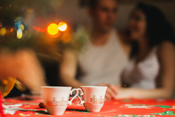 tea with honey on christmas table with new year tree
