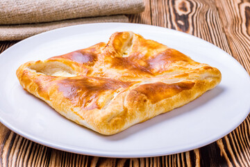 khachapuri layered georgian kitchen on wooden table