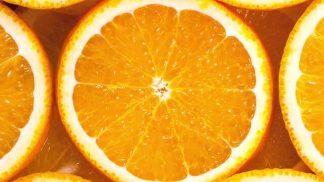 Rotation of orange slices. View from above.