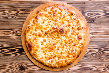 khachapuri with cheese on wooden table Georgian cuisine