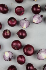 sweet red onions on background