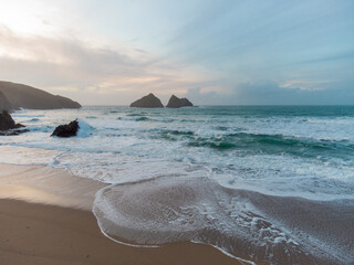 Holywell bay at sunset aerial drone image cornwall uk 