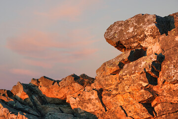 Naklejka premium Sunset over granite boulders. Outdoor background theme with copy space.