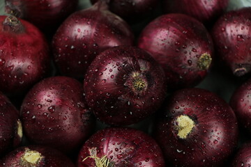 sweet red onions on background