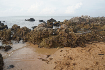 unique sandstone rocks shape by the sea. Reef stone on nature  background.