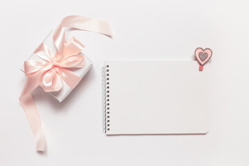 Gift and blank space for greeting on Valentine's Day, birthday, Mother's Day or International Women's Day on white background. a congratulatory letter.