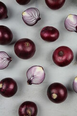 sweet red onions on background