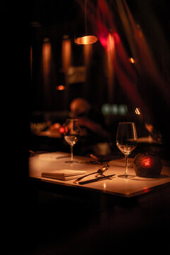 Luxury and festive dinner table. Low light environment with dominant red color.