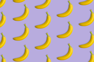 Bunch of bananas in pattern on purple background