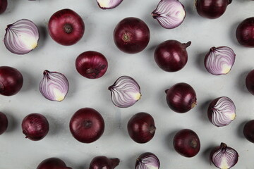 sweet red onions on background