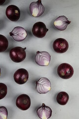 sweet red onions on background