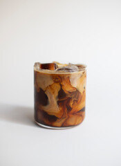 Milky iced coffee on white background