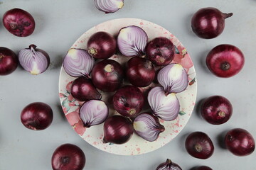 sweet red onions on background