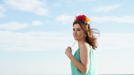 woman standing with a flower crown tiara diadem