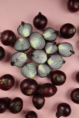 sweet red onions on background