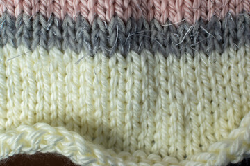 knitted texture background in pink and cream 