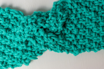 green knitted wool texture in shape of bow 
