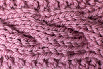 texture of pink knitted cable stitch 