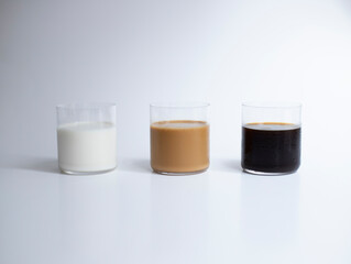 Coffee colours and milk on white background