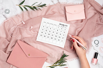 Desktop with calendar for january 2021 and office supplies. home office, social media blog,...