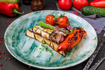 grilled vegetables on a plate on black concrete table