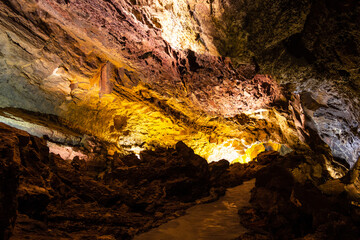 Cueva de Los Verdes lava tube illuminated in Lanzarote island, Spain. Geological cavern formation, tourist attraction concepts