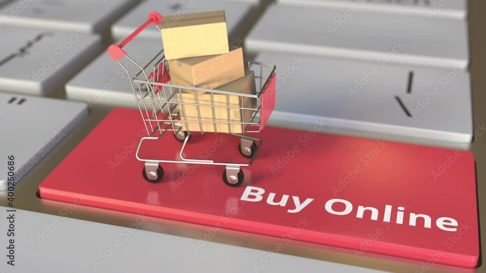Poster buy online text on computer keyboard and boxes in small shopping cart. electronic business conceptua