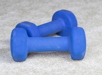 Rubber Coated Dumbbells on Floor