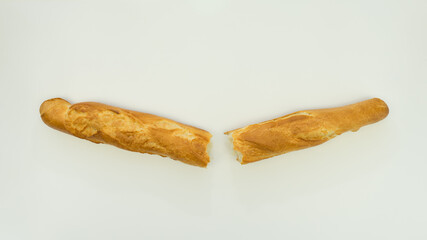 Fresh and crispy French baguettes on a white plate. Isolate