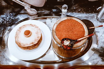 Pancakes and red caviar in a shop window. Russian New year traditional