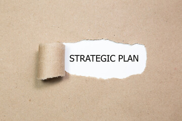 Strategic Plan word under torn paper 