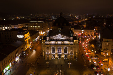 Aerial view on Lviv Opera at night from drone