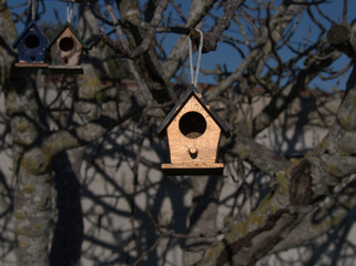 Small wooden house to hang the branches from the trees