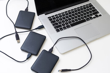External backup disk hard drive connected to laptop