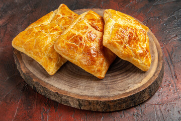 bottom view penovani khachapuri on wood board on dark red background georgian cuisine