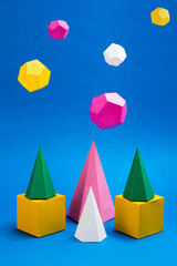 Various geometric shapes made from paper