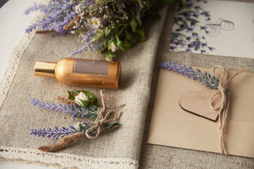 boho style wedding envelope on table with lavender