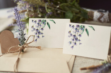 cards for lettering names blank, envelope on table