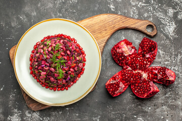 top view vinaigrette salad with beets and beans on the dark background health food photo