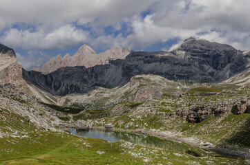 Fototapeta na wymiar View of Crespeina lake, located west of Gardenacia plateau, as seen on High Route #2 from Puez refuge to Gardena valley, Puez-Odle Nature park, Dolomites, South Tirol, Italy.