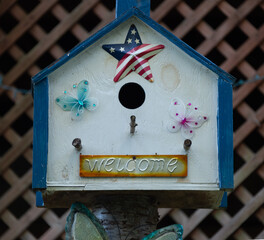 Patriotic bird house with welcome sign. Green Mountain RV Park, North Carolina.