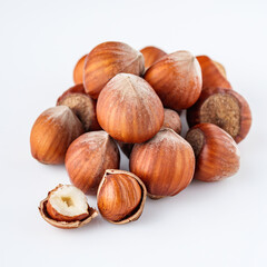 fresh natural hazelnuts on a white acrylic background
