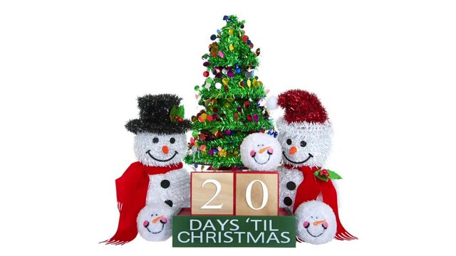 HD video countdown to Christmas light beech wood blocks with numbers counting down 25 to 1  with tinsel Christmas tree, Mr and Mrs snowman and snowball snowmen heads on a blizzard whiteout background.