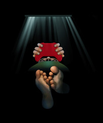 Don’t bother me, I’m gaming. A video game player lies on his or her back looking up at a video screen as they hold the controller in hand. Barefeet indicate this person is relaxing.