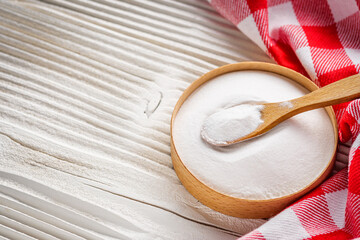 baking soda powder on wooden rustic background background