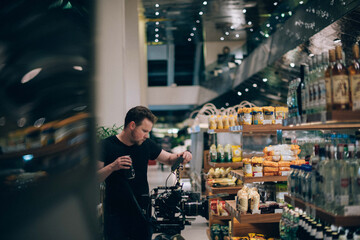 Director of photography with a camera in his hands on the set.