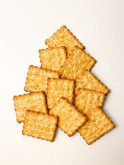 cookies with sugar sprinkles and sesame seeds on a white table
