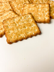 cookies with sugar sprinkles and sesame seeds on a white table